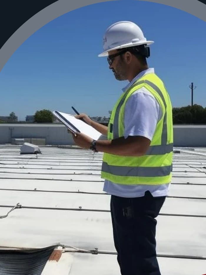 An eMGee Exteriors crew working on a roof